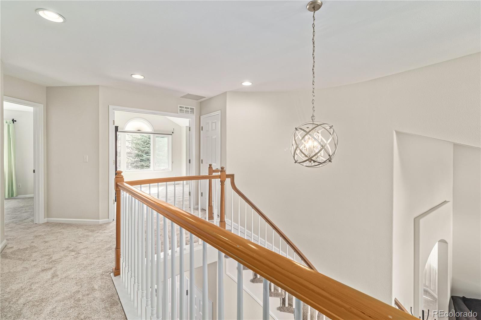 10152 Knoll Circle Highlands Ranch, CO 80130 - Photo 13 of 34 a view of entryway and hall with wooden floor