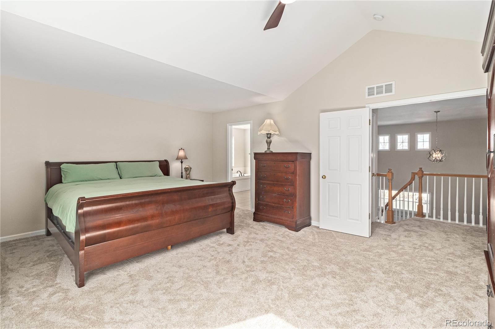 10152 Knoll Circle Highlands Ranch, CO 80130 - Photo 14 of 34 a room with a bed and a cabinets