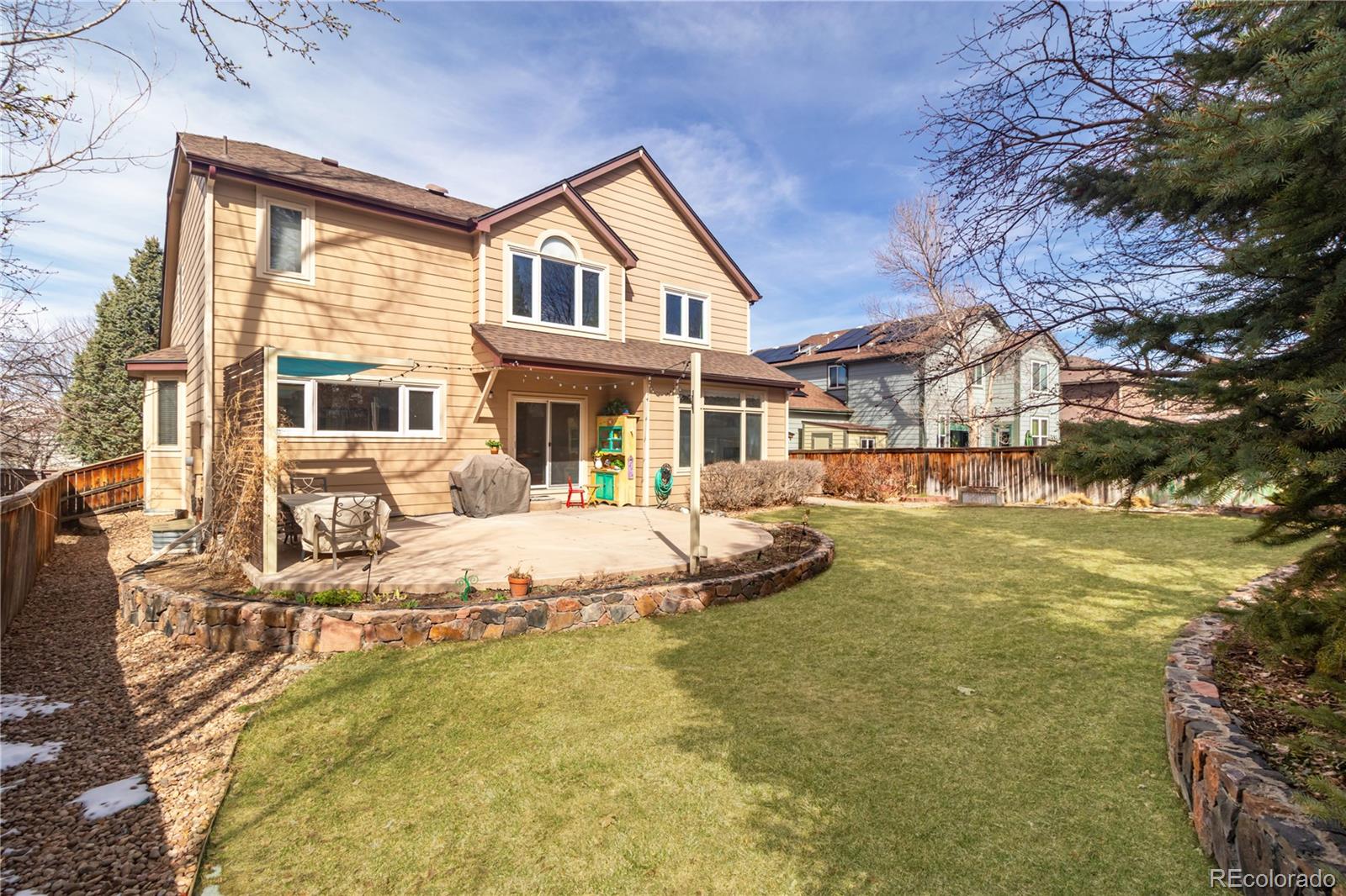 10152 Knoll Circle Highlands Ranch, CO 80130 - Photo 21 of 34 a view of a house with swimming pool