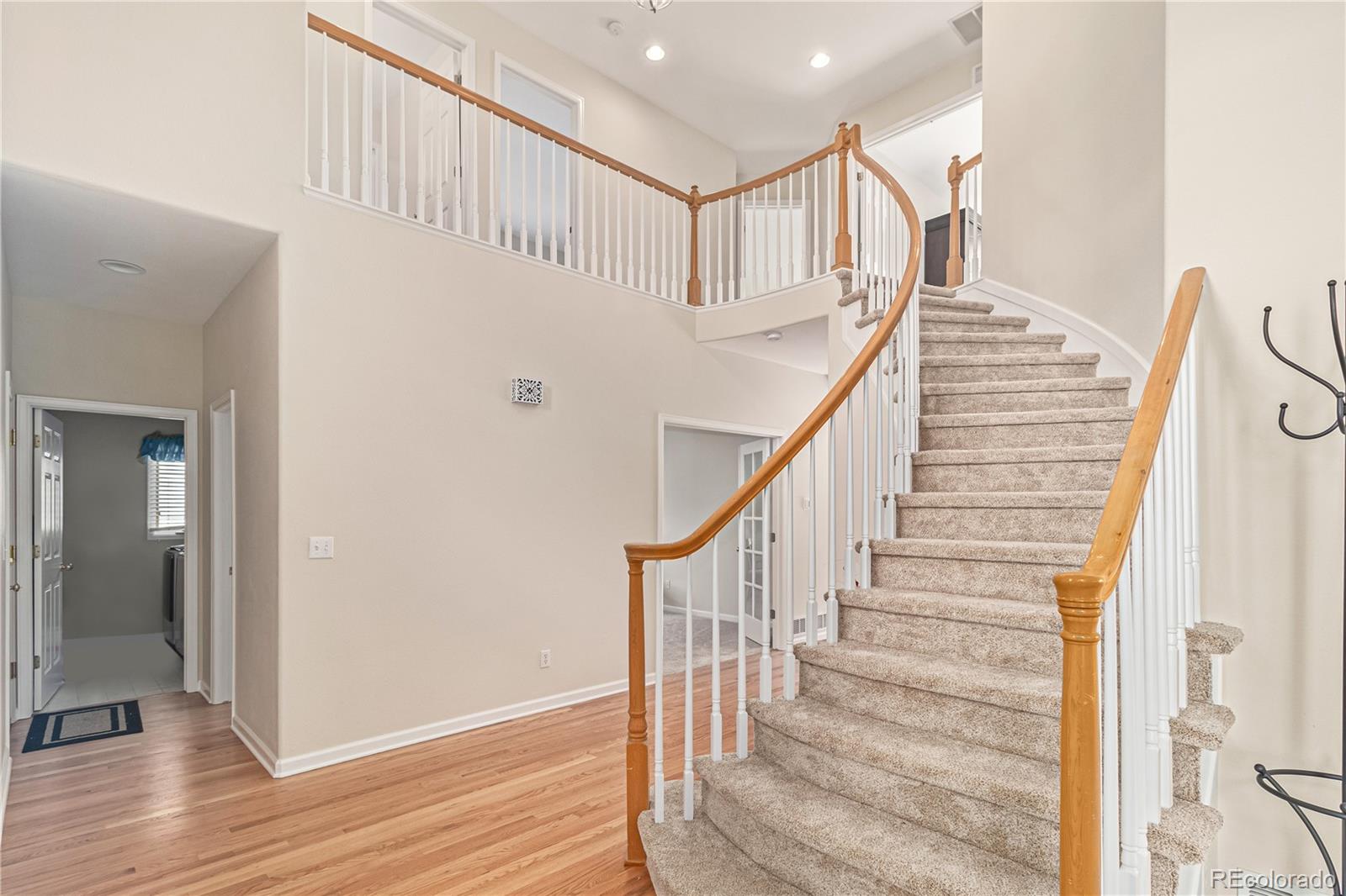 10152 Knoll Circle Highlands Ranch, CO 80130 - Photo 3 of 34 a view of entryway with wooden floor
