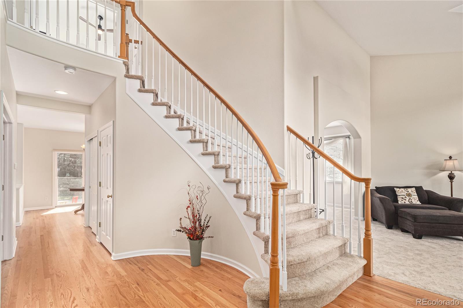 10152 Knoll Circle Highlands Ranch, CO 80130 - Photo 4 of 34 a view of entryway and hall with wooden floor