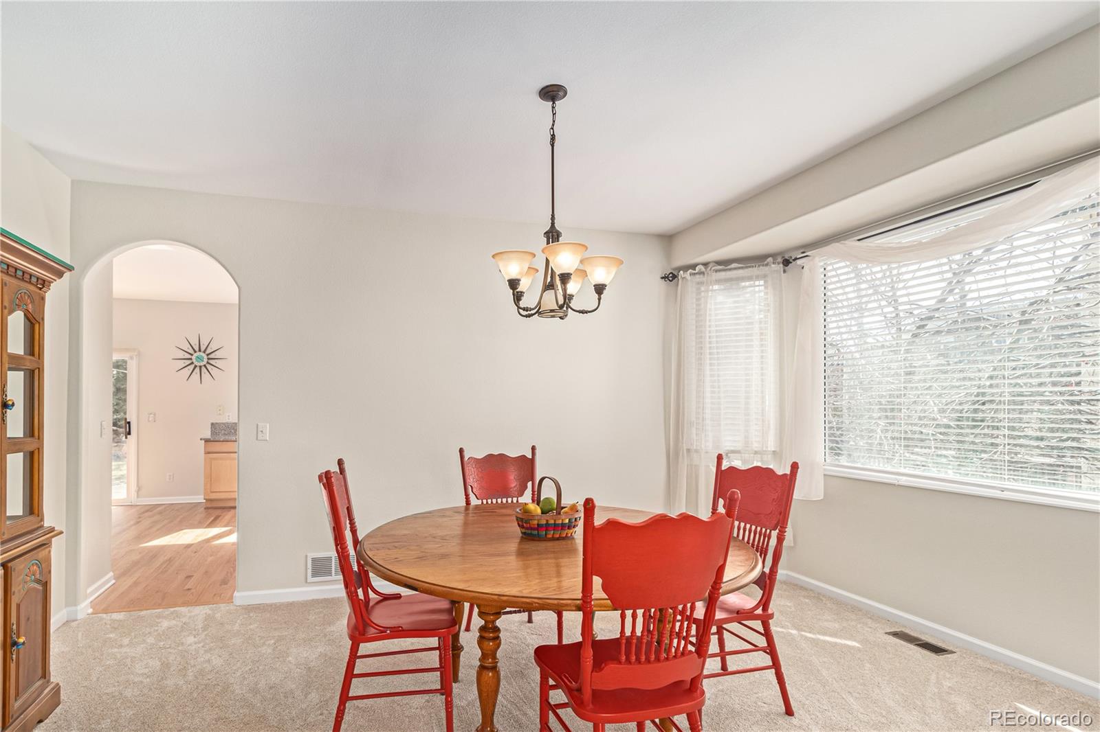 10152 Knoll Circle Highlands Ranch, CO 80130 - Photo 6 of 34 a view of a dining room with furniture window and outside view