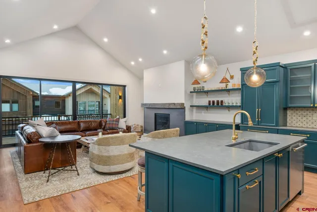 a kitchen with a sink and a large window