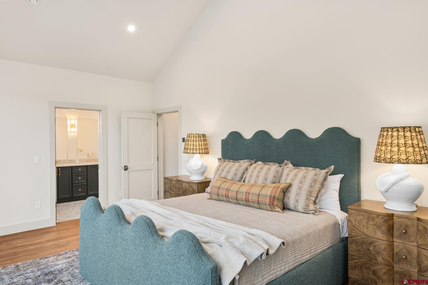 180 Elk Valley Road, Unit 116 Crested Butte, CO 81224 - Photo 13 of 26 a bedroom with a bed and a window