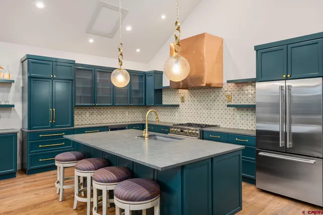 a kitchen with a table and chairs in it
