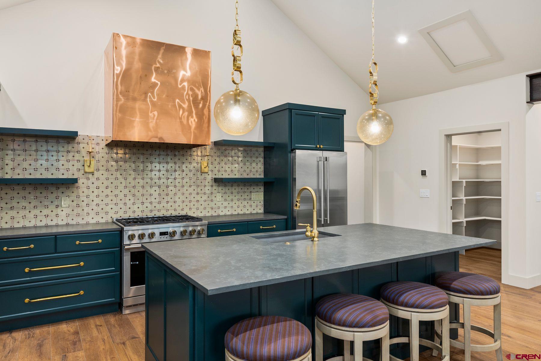 180 Elk Valley Road, Unit 116 Crested Butte, CO 81224 - Photo 5 of 26 a kitchen with a table and chairs in it