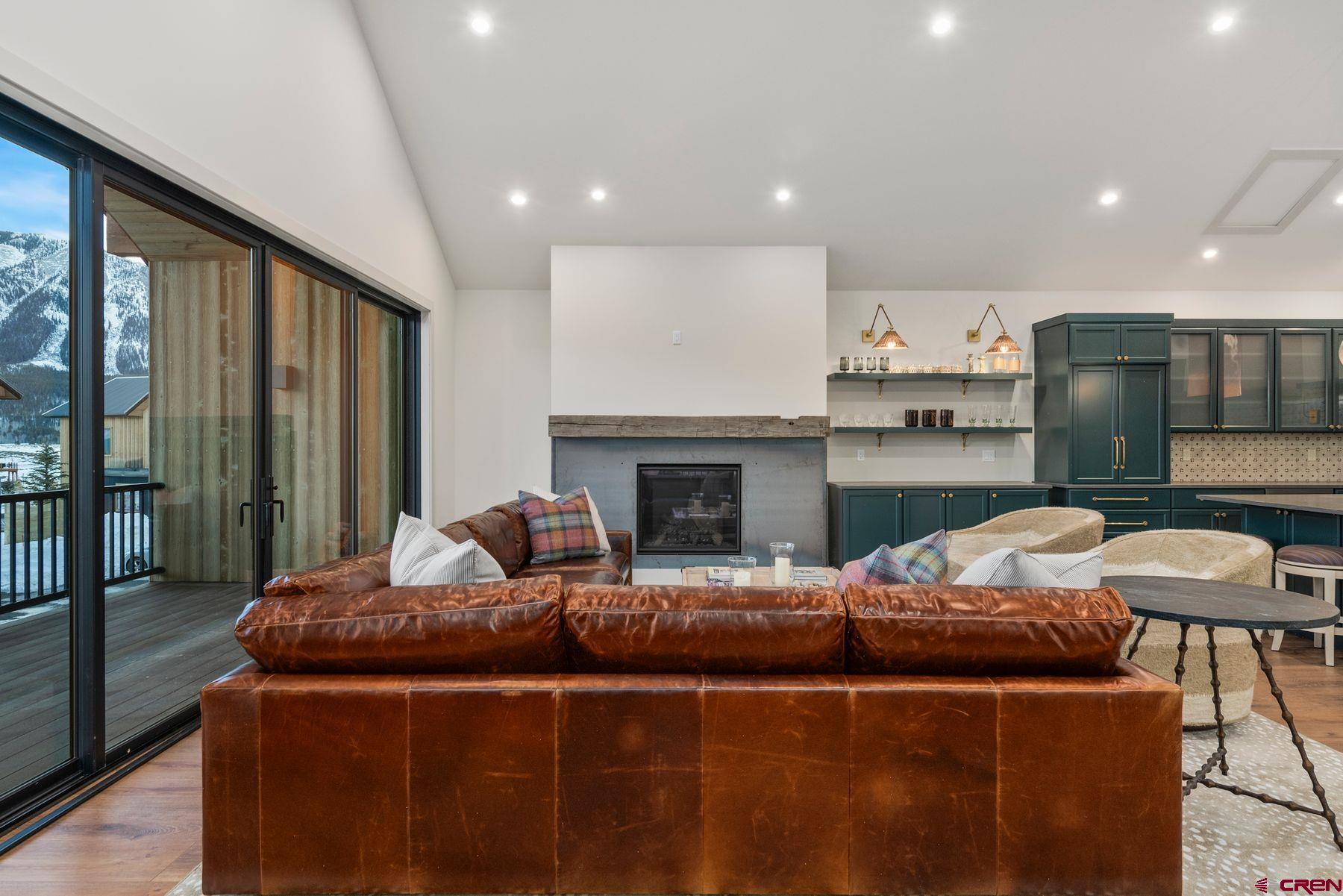 180 Elk Valley Road, Unit 116 Crested Butte, CO 81224 - Photo 6 of 26 a living room with furniture and a fireplace