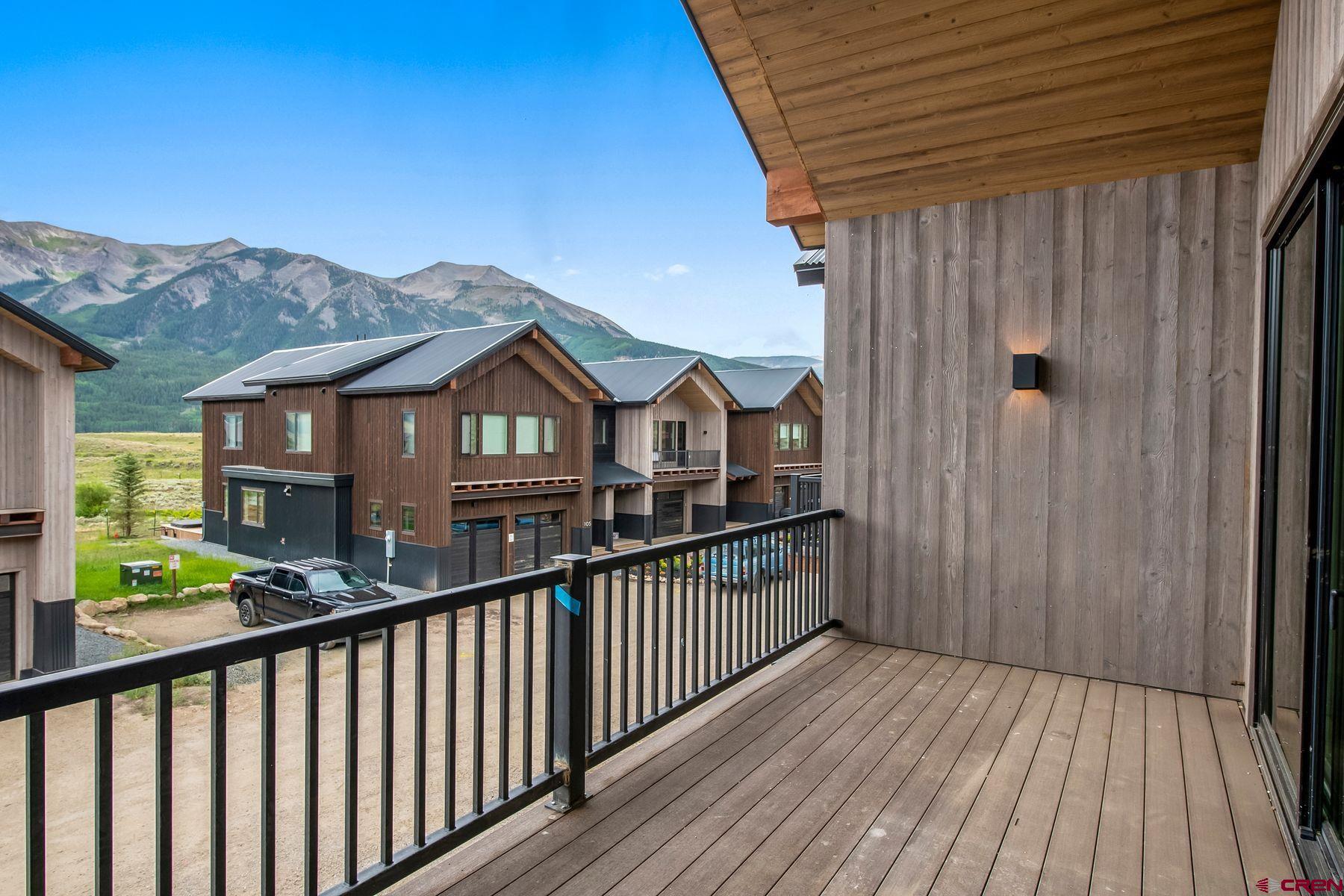 180 Elk Valley Road, Unit 116 Crested Butte, CO 81224 - Photo 8 of 26 a view of a wooden house with a street view