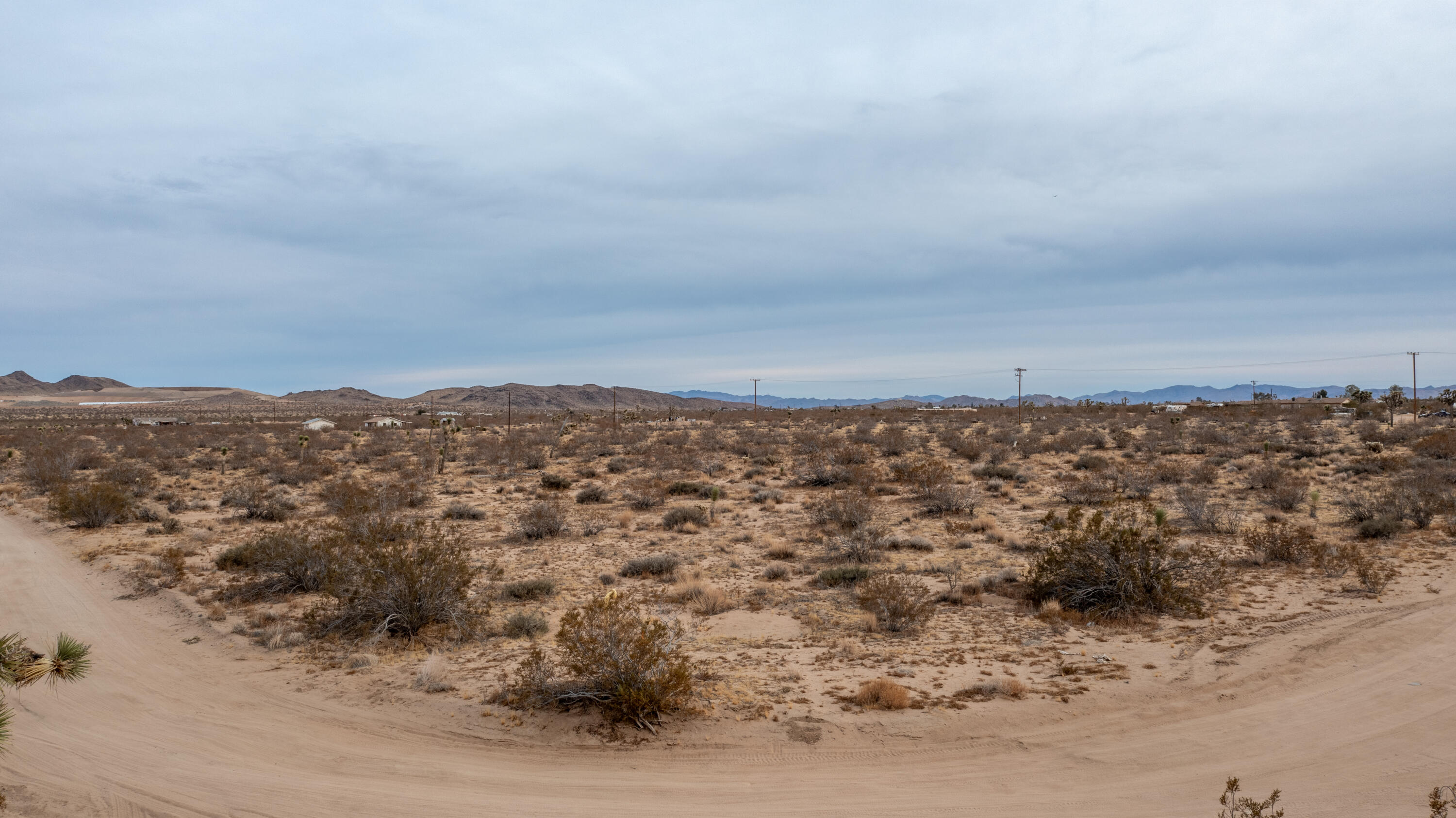 57755 Boo Lane Yucca Valley, CA 92284 - Photo 3 of 13 an aerial view of a house with a mountain in the background