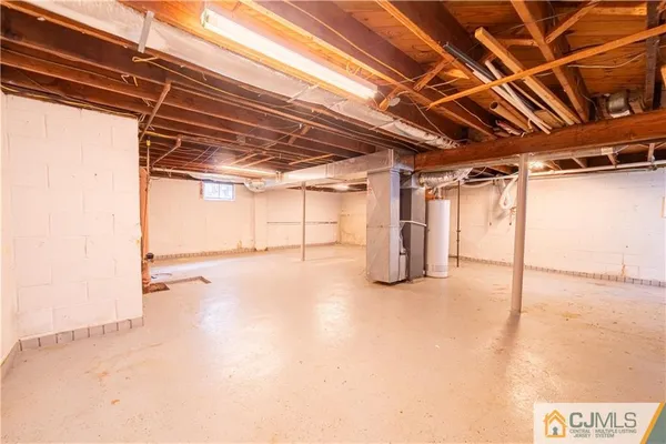 a view of empty room with wooden walls