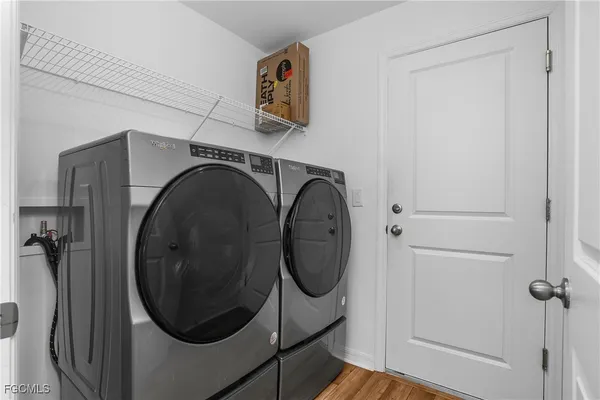 a utility room with dryer and washer