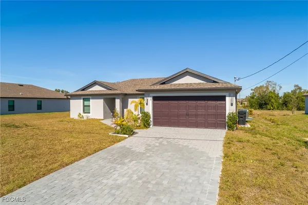 a front view of a house with yard