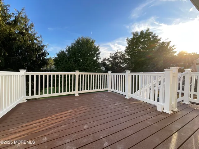 a balcony with wooden floor