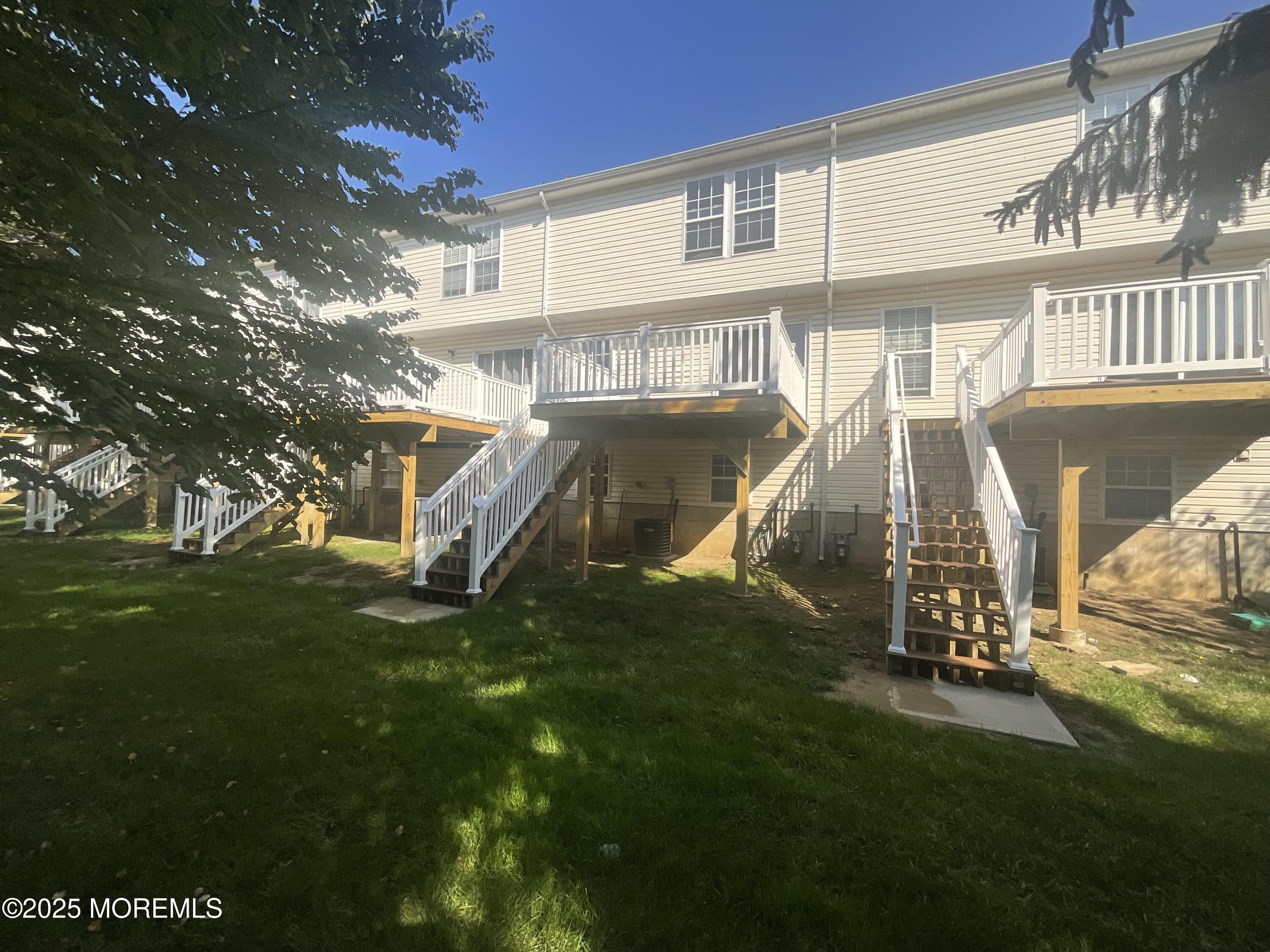 12 Abby Road, Unit 75 Farmingdale, NJ 07727 - Photo 12 of 20 a view of a house with a yard