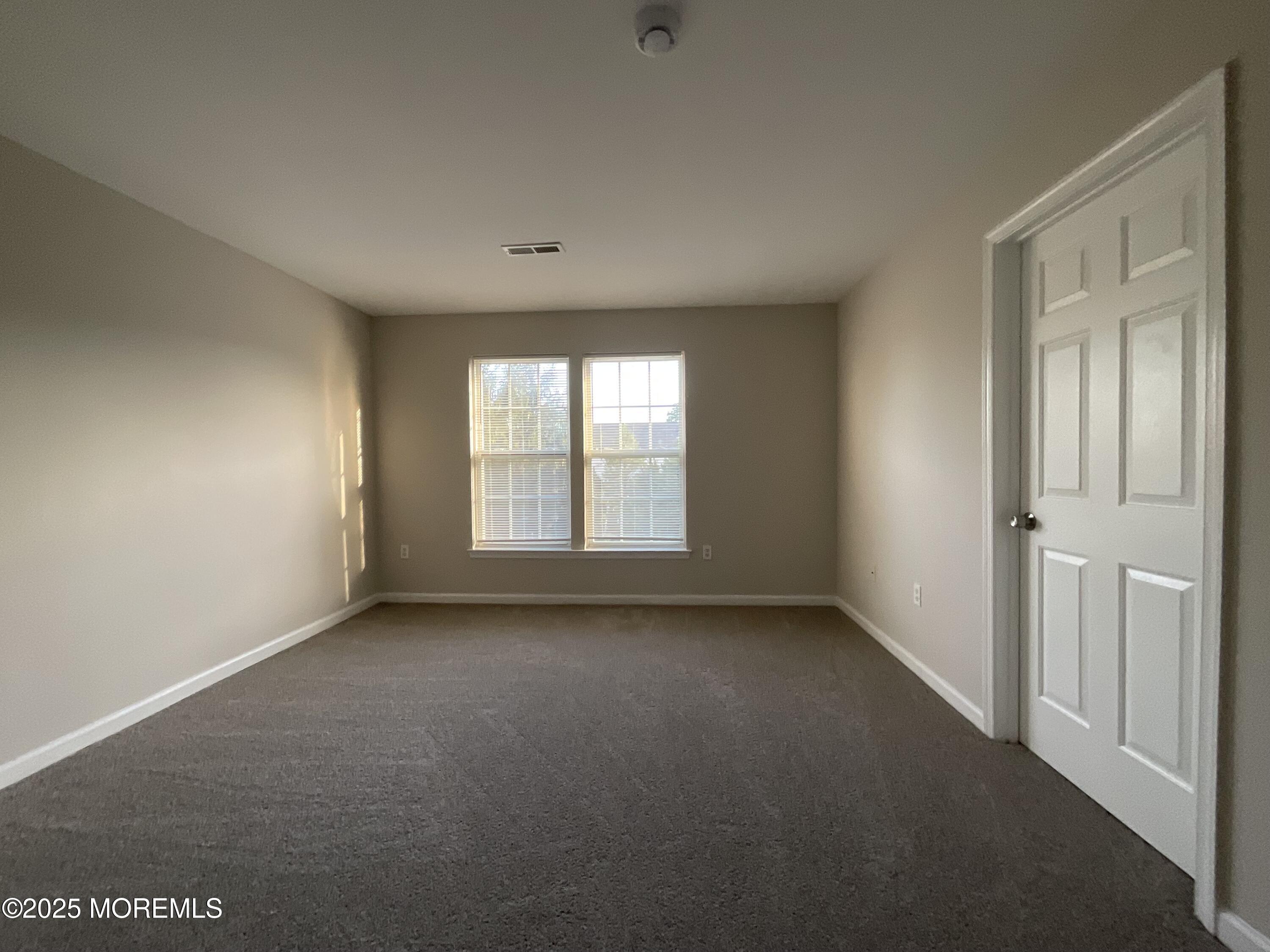 12 Abby Road, Unit 75 Farmingdale, NJ 07727 - Photo 13 of 20 a view of an empty room with a window