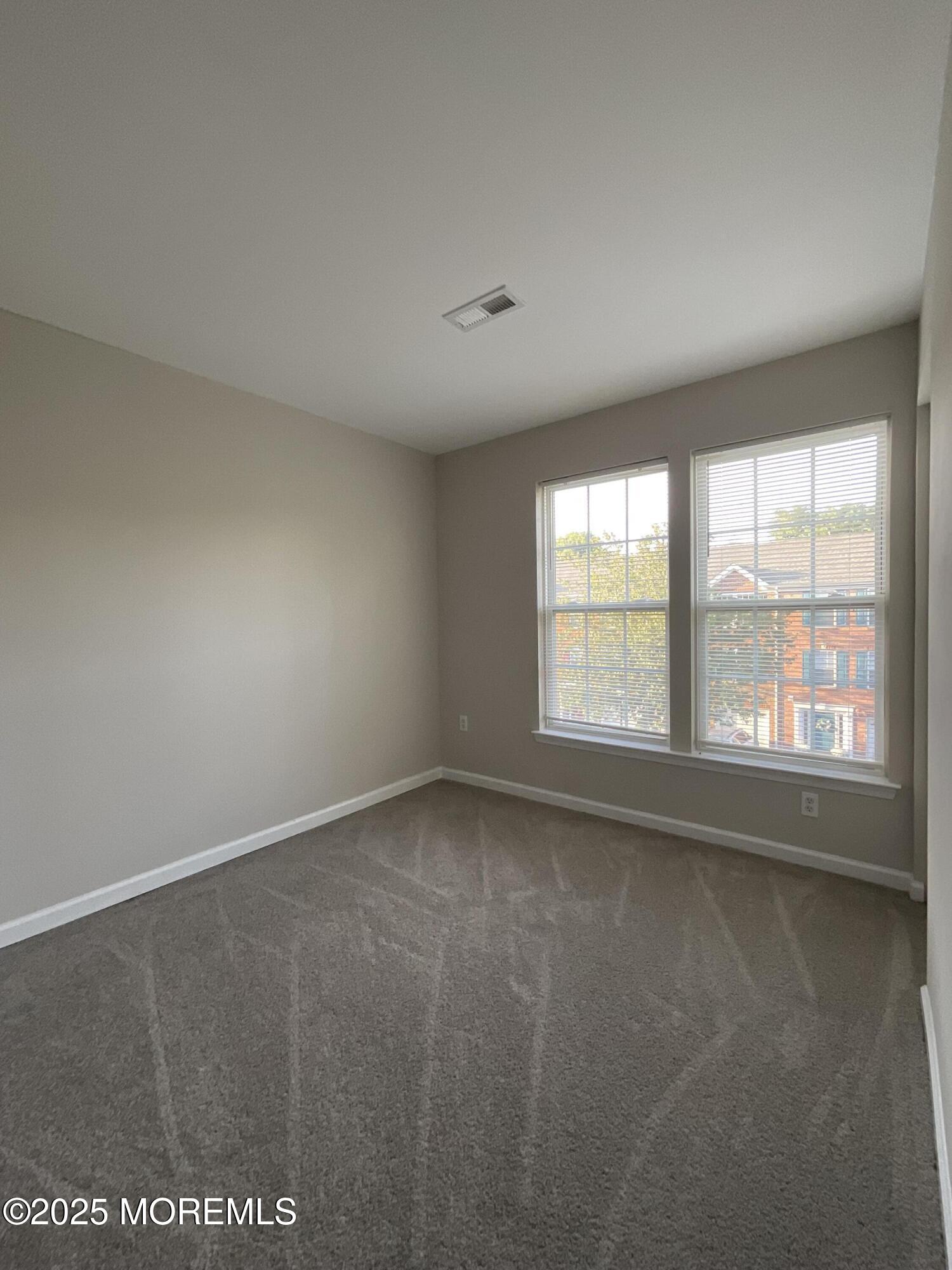 12 Abby Road, Unit 75 Farmingdale, NJ 07727 - Photo 17 of 20 an empty room with a window