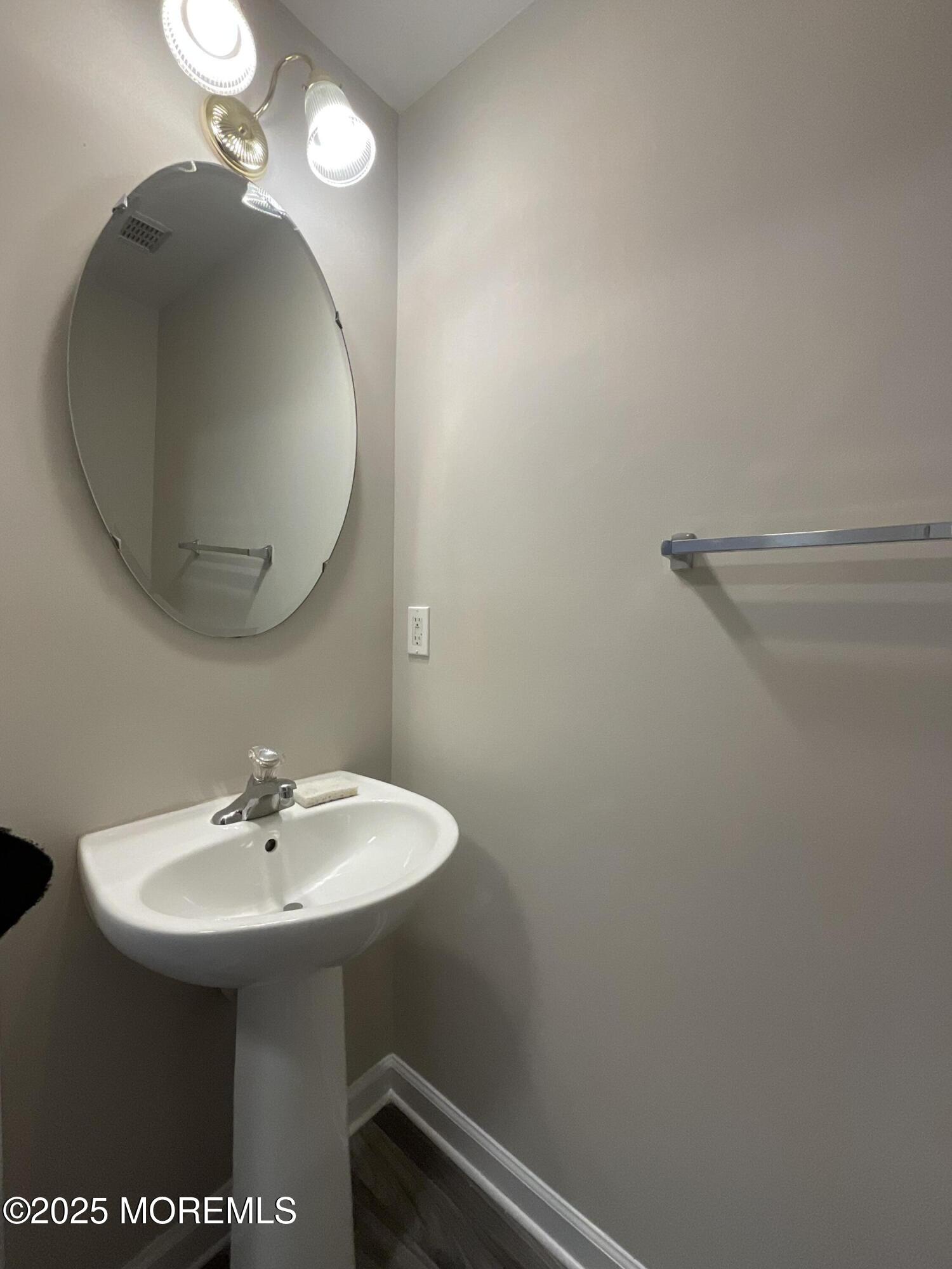 12 Abby Road, Unit 75 Farmingdale, NJ 07727 - Photo 4 of 20 a bathroom with a sink and a mirror
