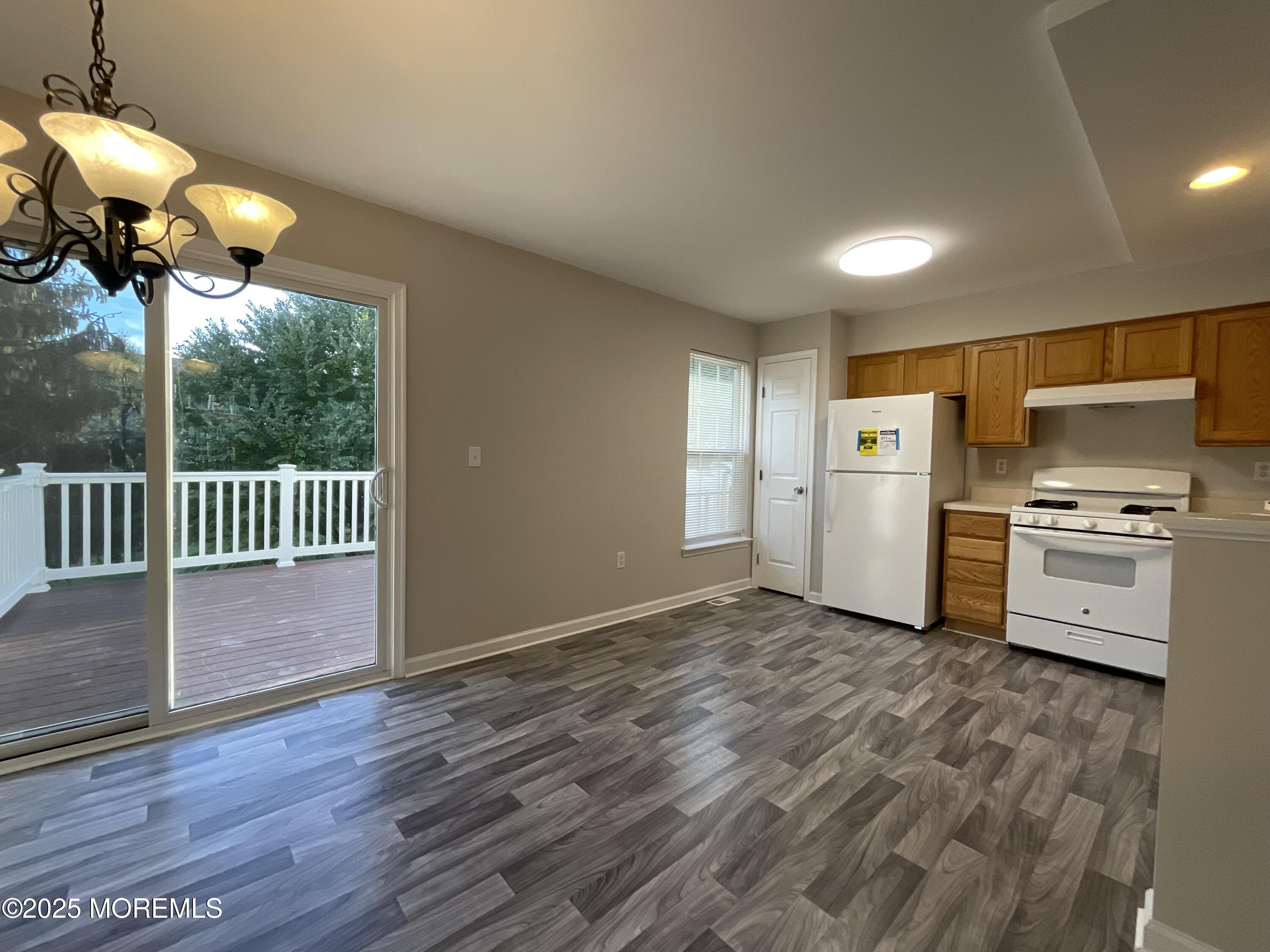 12 Abby Road, Unit 75 Farmingdale, NJ 07727 - Photo 10 of 20 a view of a kitchen with a sink wooden floor and a window