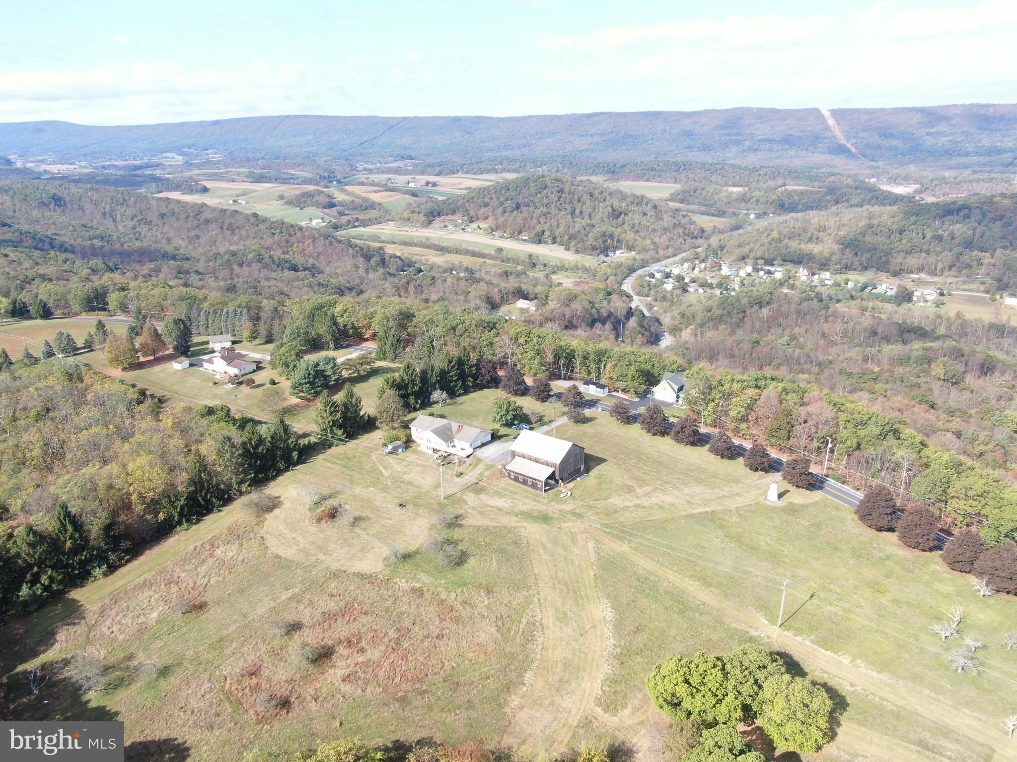 13677 Piney Ridge Road Huntingdon, PA 16652 - Photo 13 of 93 a view of a dry yard with mountains in the background