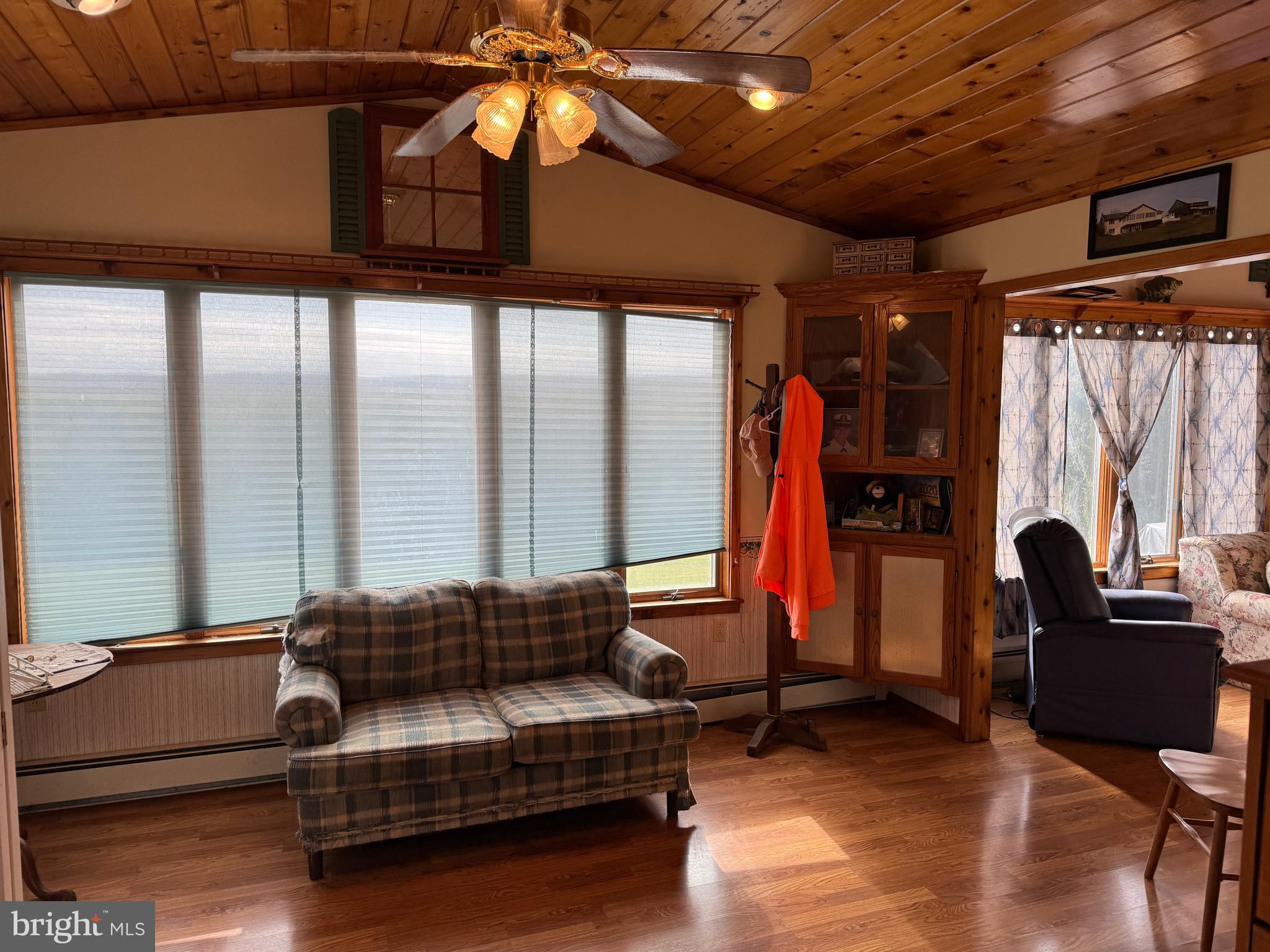 13677 Piney Ridge Road Huntingdon, PA 16652 - Photo 39 of 93 a living room with furniture a ceiling fan and a window