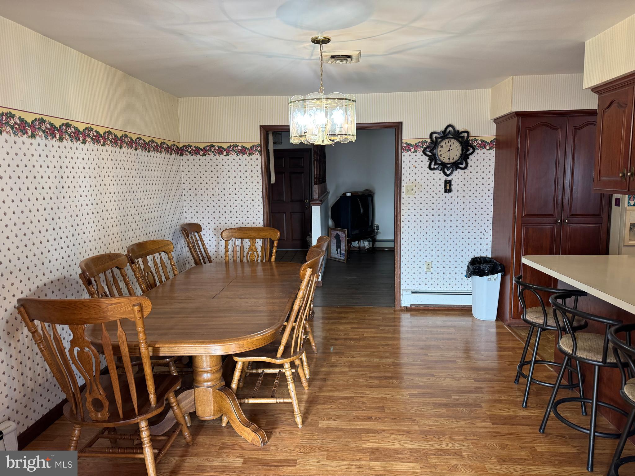 13677 Piney Ridge Road Huntingdon, PA 16652 - Photo 46 of 93 a dining room with furniture a chandelier and wooden floor