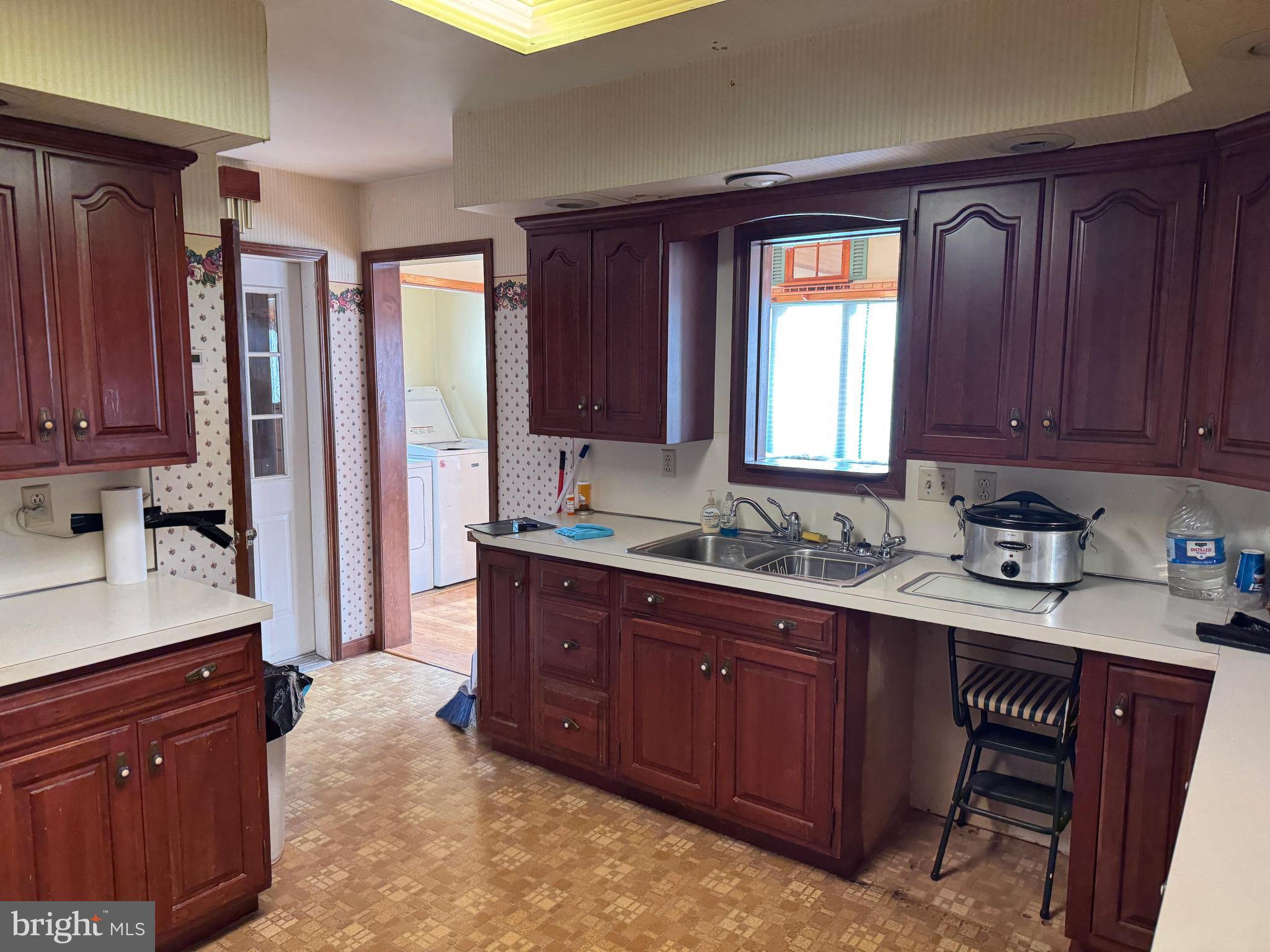 13677 Piney Ridge Road Huntingdon, PA 16652 - Photo 48 of 93 a kitchen with stainless steel appliances granite countertop wooden cabinets a sink and dishwasher with a large window