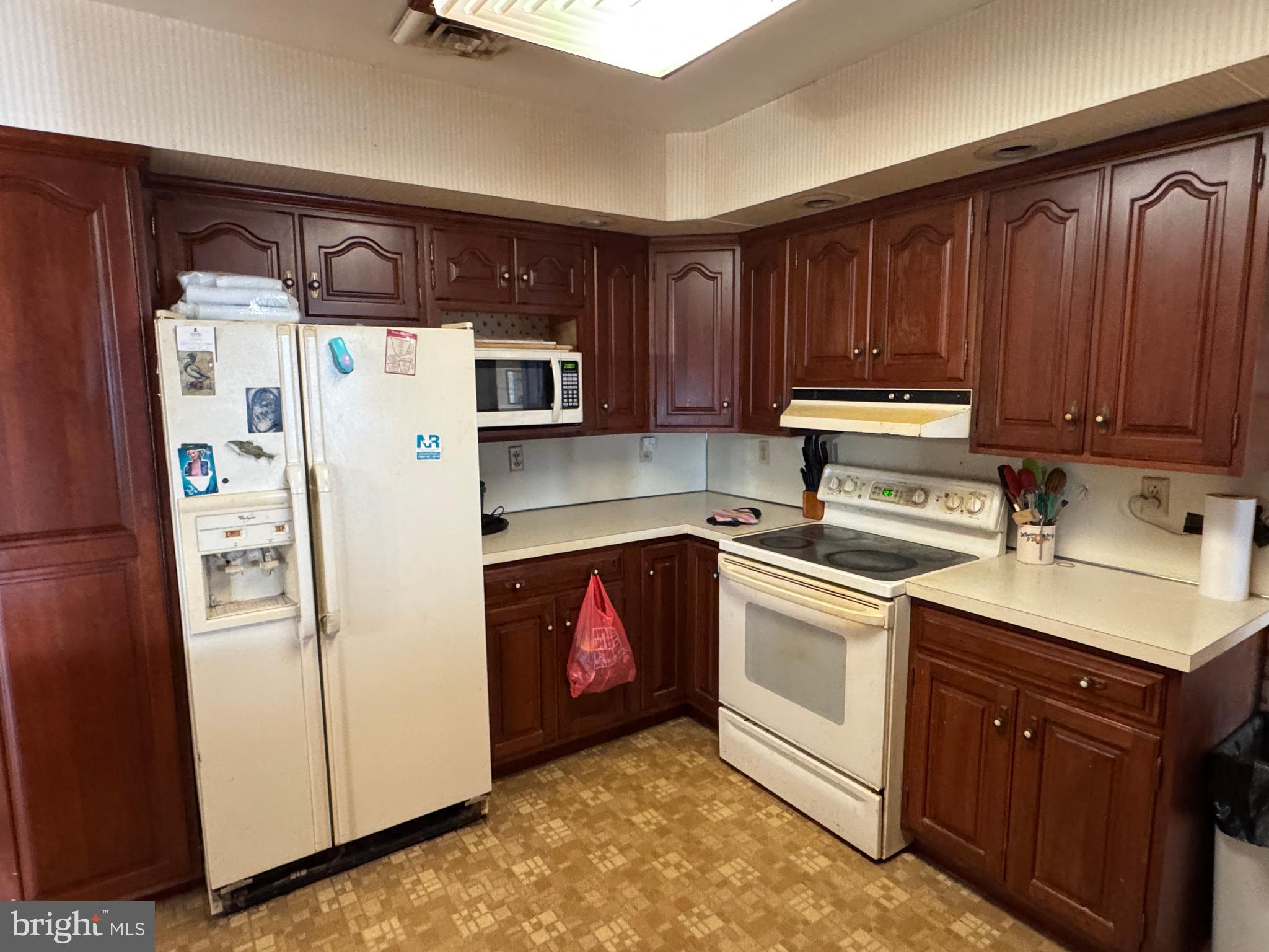 13677 Piney Ridge Road Huntingdon, PA 16652 - Photo 51 of 93 a kitchen with a refrigerator sink and cabinets