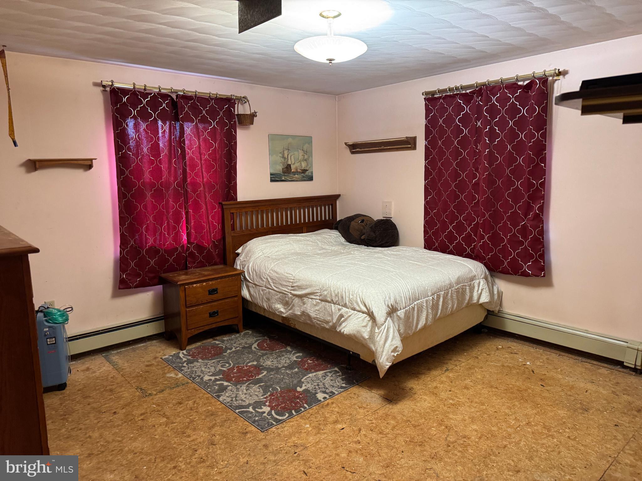 13677 Piney Ridge Road Huntingdon, PA 16652 - Photo 56 of 93 a bedroom with a bed and a dresser