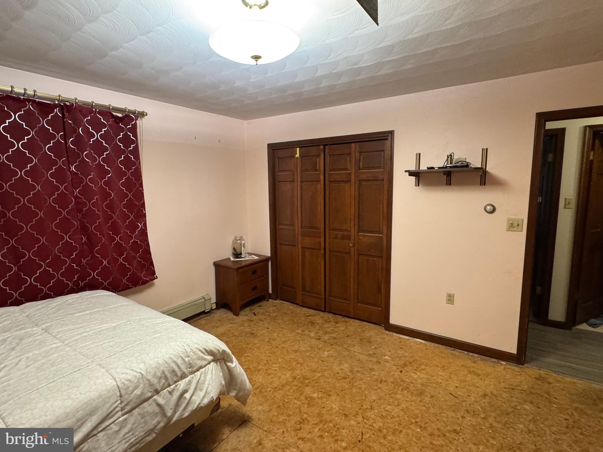 13677 Piney Ridge Road Huntingdon, PA 16652 - Photo 57 of 93 a bedroom with a bed and a dresser