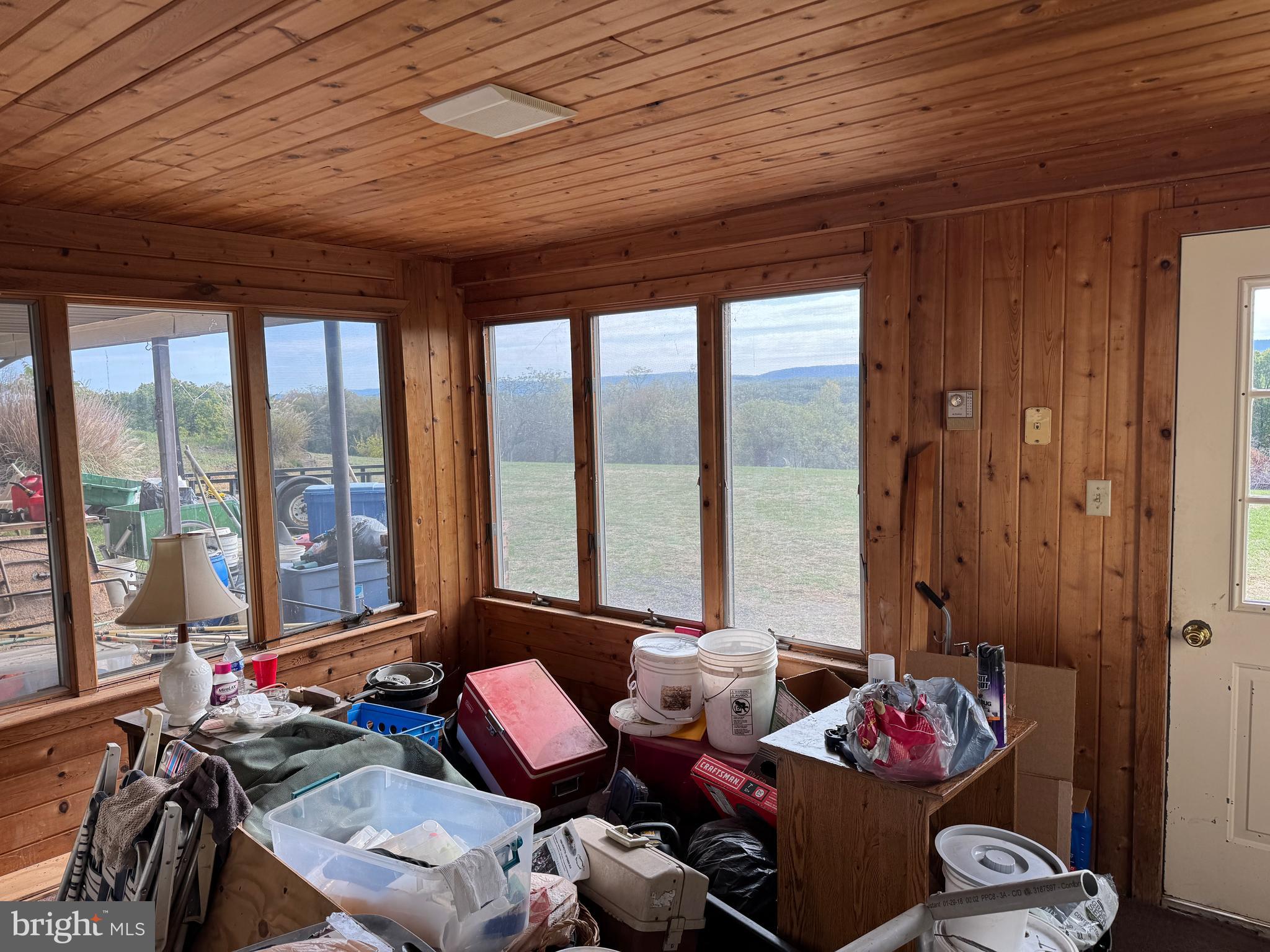 13677 Piney Ridge Road Huntingdon, PA 16652 - Photo 72 of 93 a living room with furniture and floor to ceiling window