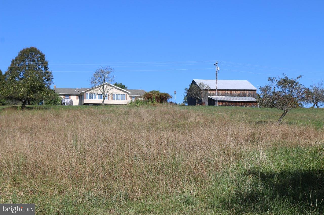 13677 Piney Ridge Road Huntingdon, PA 16652 - Photo 93 of 93 a view of a lake with a big yard and large trees