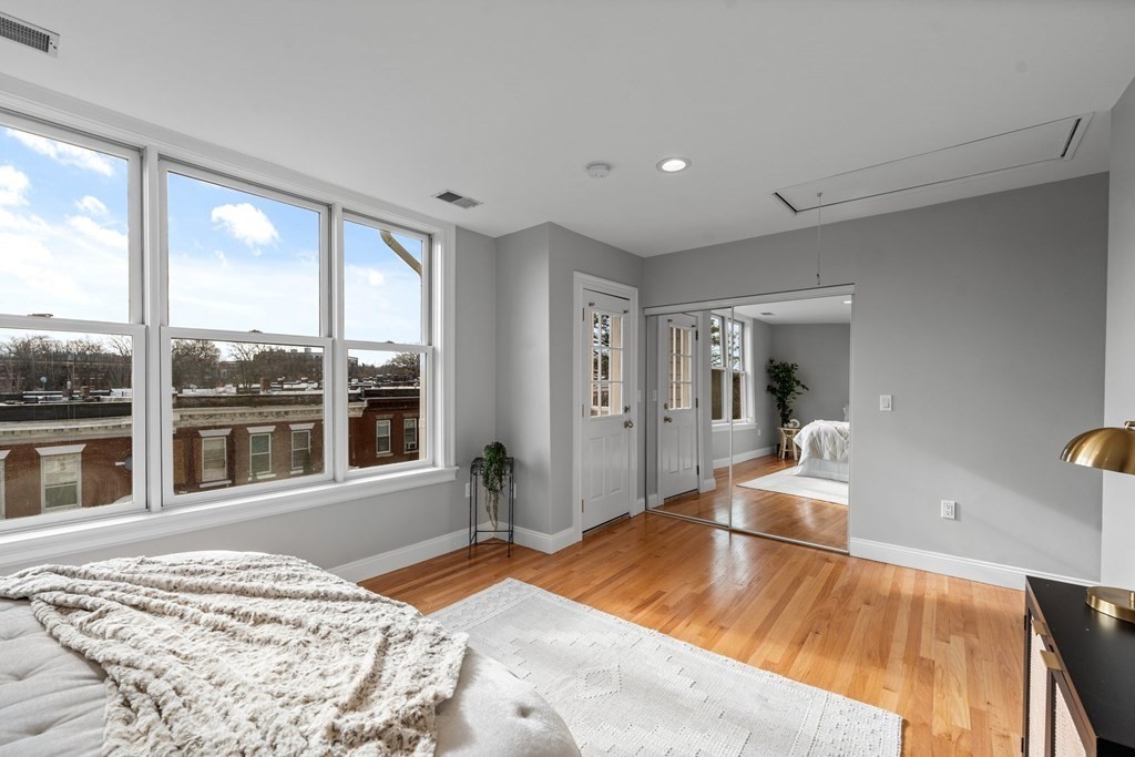 39 Leamington Road, Unit 39 Boston, MA 02135 - Photo 17 of 32 a bedroom with furniture and large window