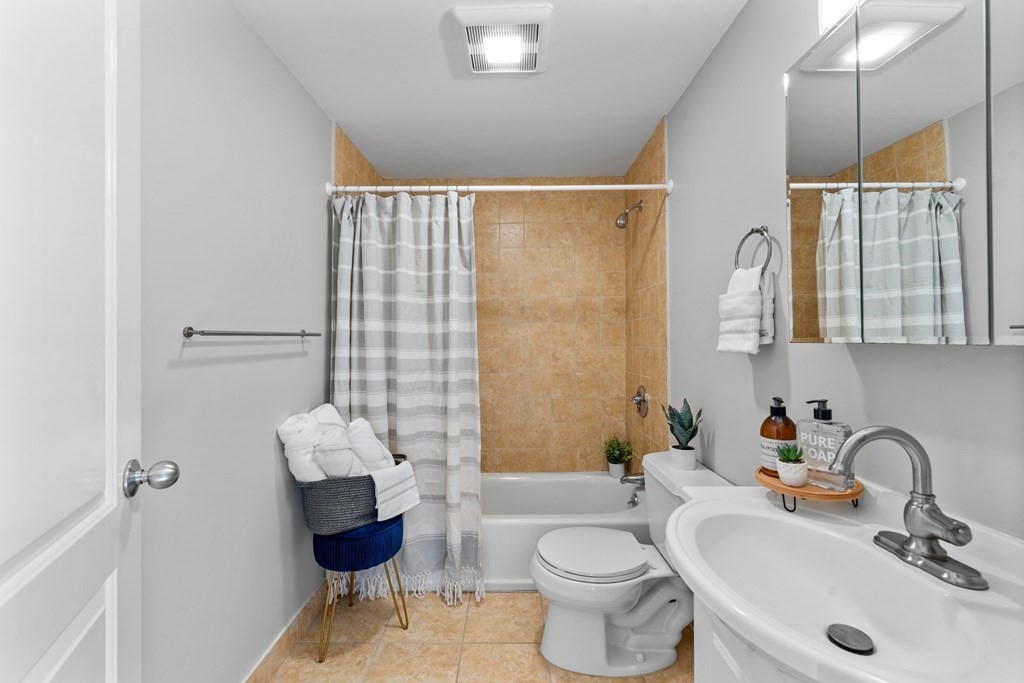 39 Leamington Road, Unit 39 Boston, MA 02135 - Photo 18 of 32 a bathroom with a sink toilet and shower