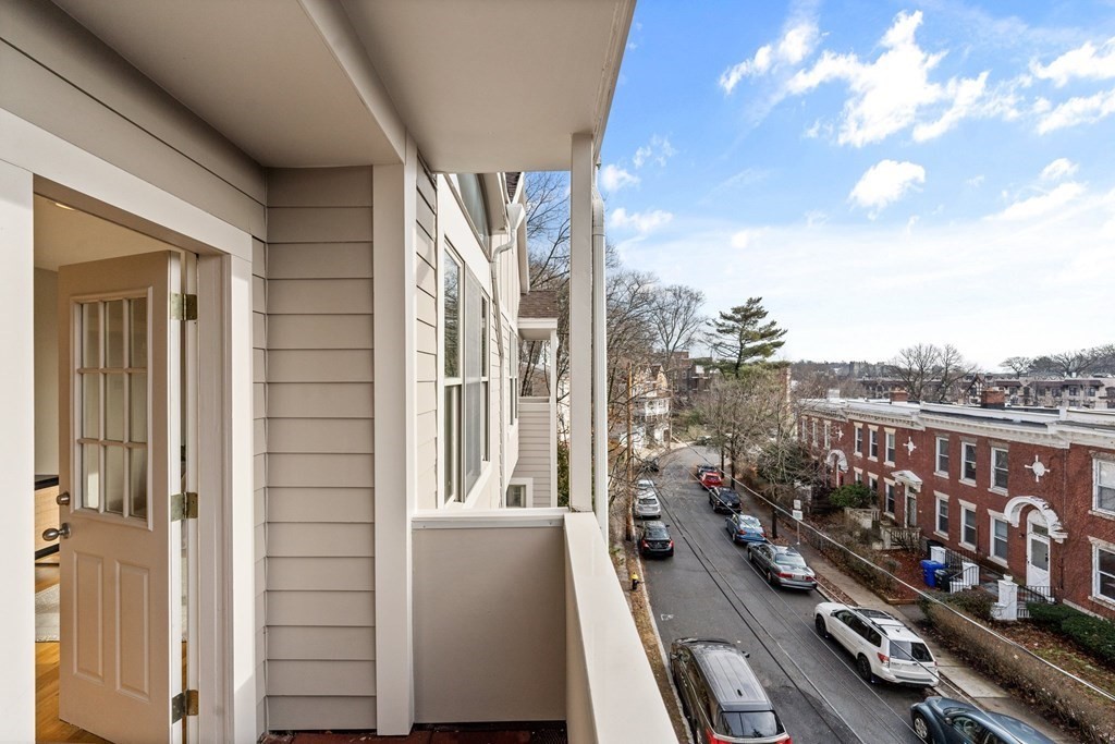 39 Leamington Road, Unit 39 Boston, MA 02135 - Photo 20 of 32 a view of a balcony with chairs