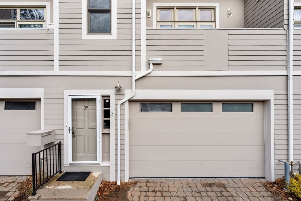 39 Leamington Road, Unit 39 Boston, MA 02135 - Photo 29 of 32 a front view of a house with a garage