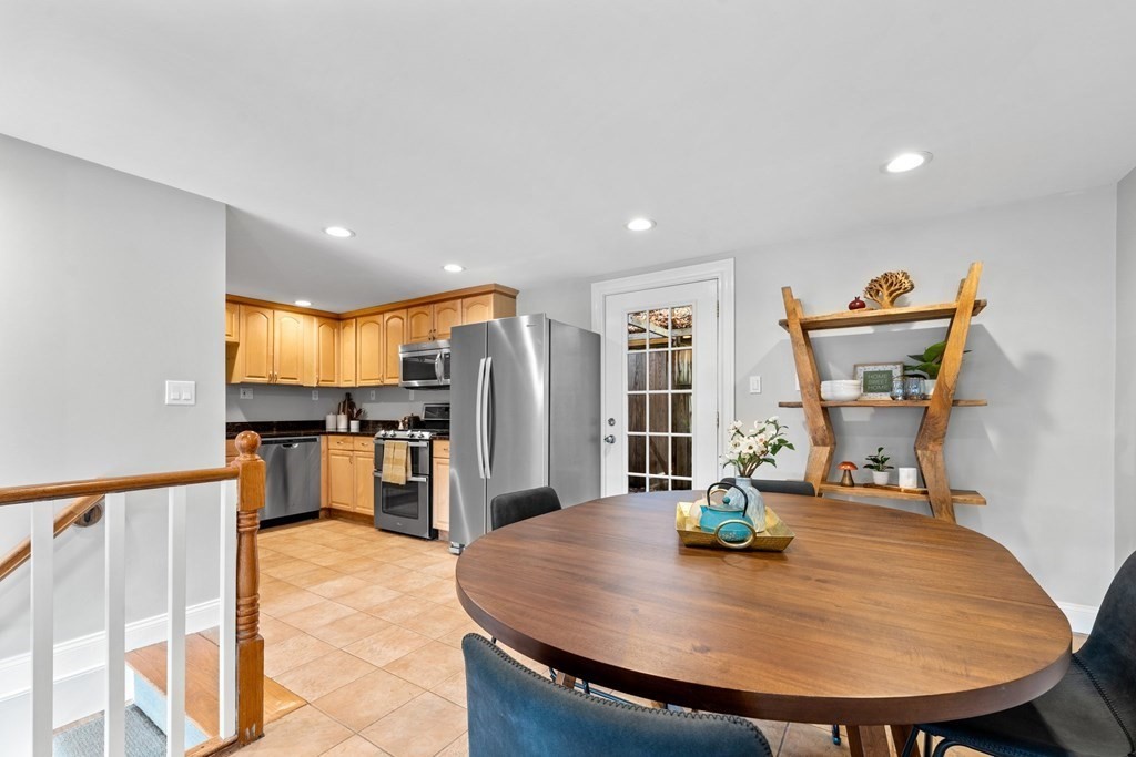 39 Leamington Road, Unit 39 Boston, MA 02135 - Photo 6 of 32 a view of a kitchen with refrigerator and dining table