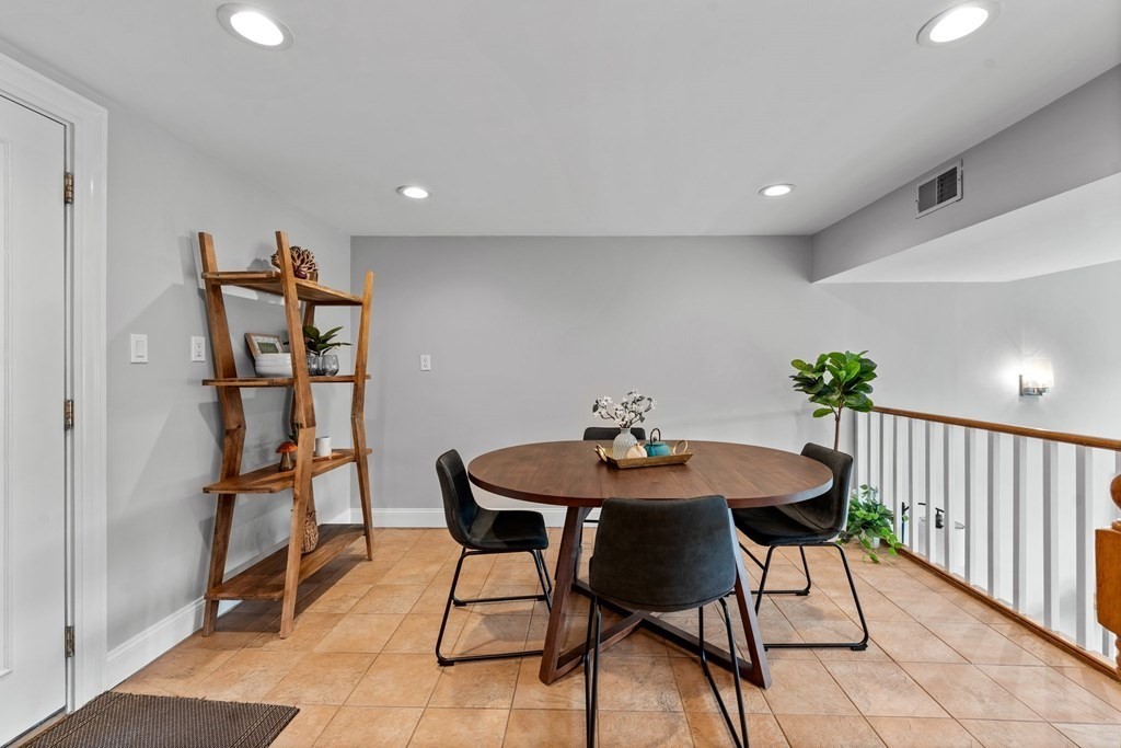 39 Leamington Road, Unit 39 Boston, MA 02135 - Photo 7 of 32 a view of a room with furniture and wooden floor