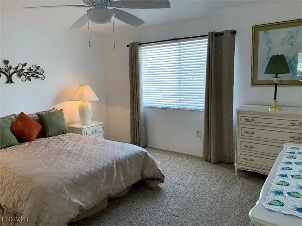 a bedroom with a bed and a cabinets