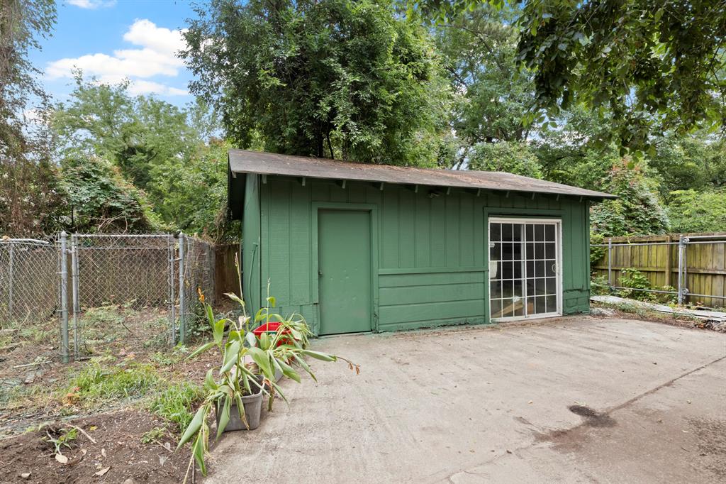 504 East 3rd Street Mount Pleasant, TX 75455 - Photo 28 of 28 a front view of a house with a yard and garage
