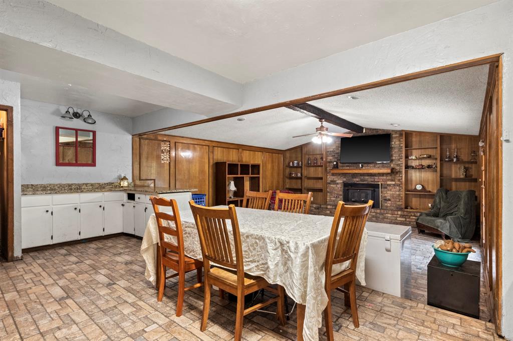 504 East 3rd Street Mount Pleasant, TX 75455 - Photo 7 of 28 a view of a dining room with furniture and wooden floor