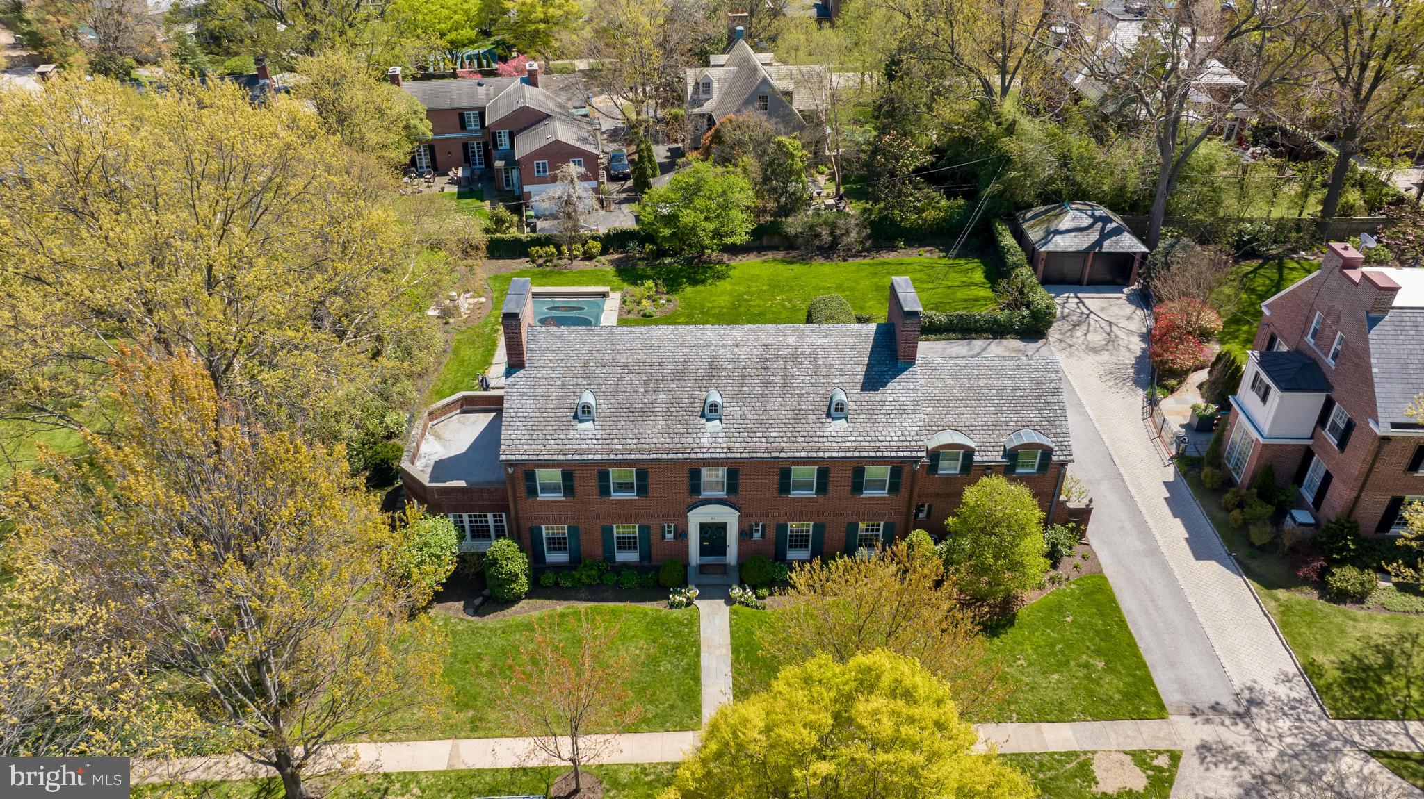 an aerial view of a house with a yard basket ball court and outdoor seating