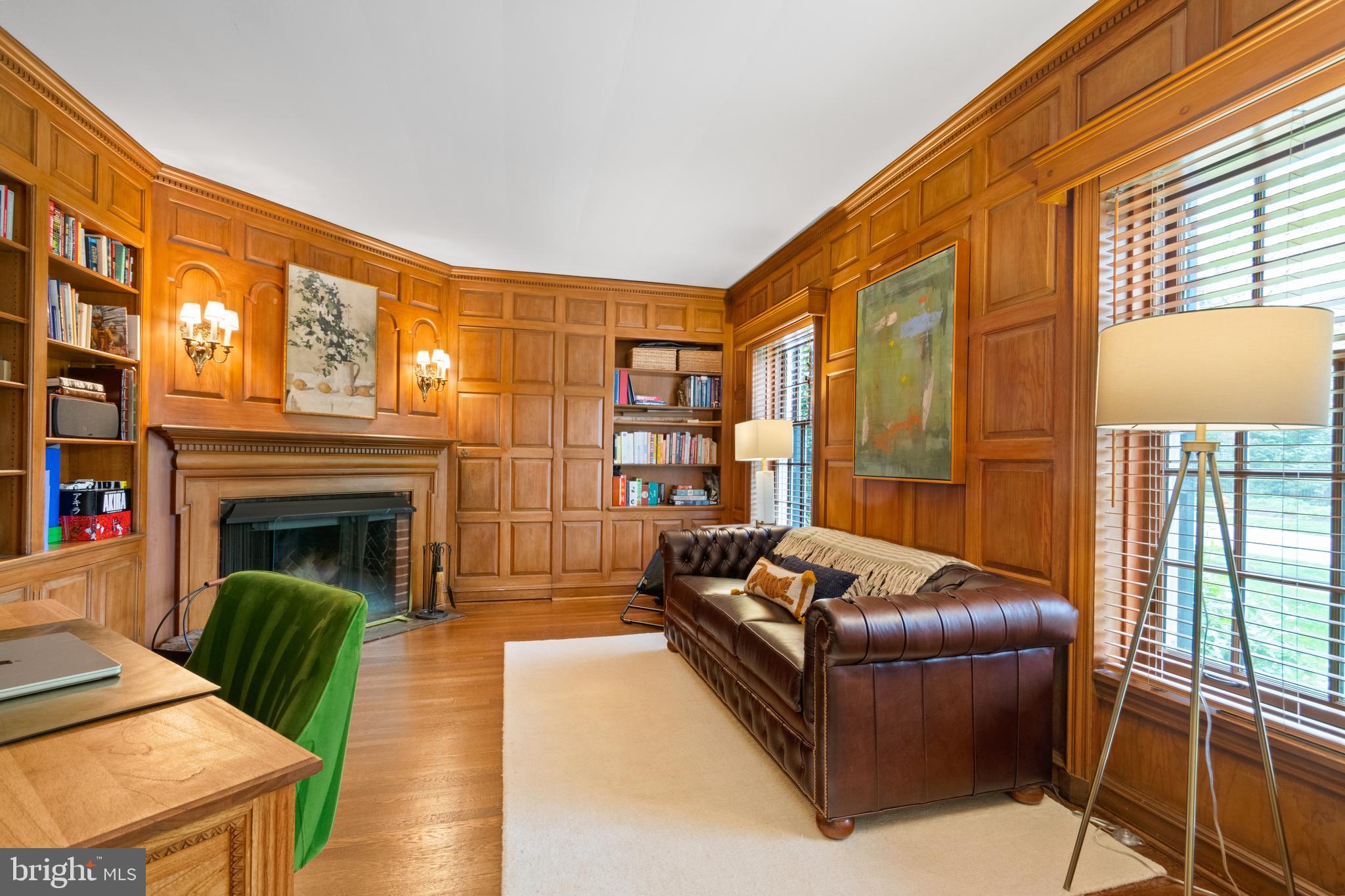 211 Lambeth Road Baltimore, MD 21218 - Photo 12 of 55 a living room with furniture and a fireplace