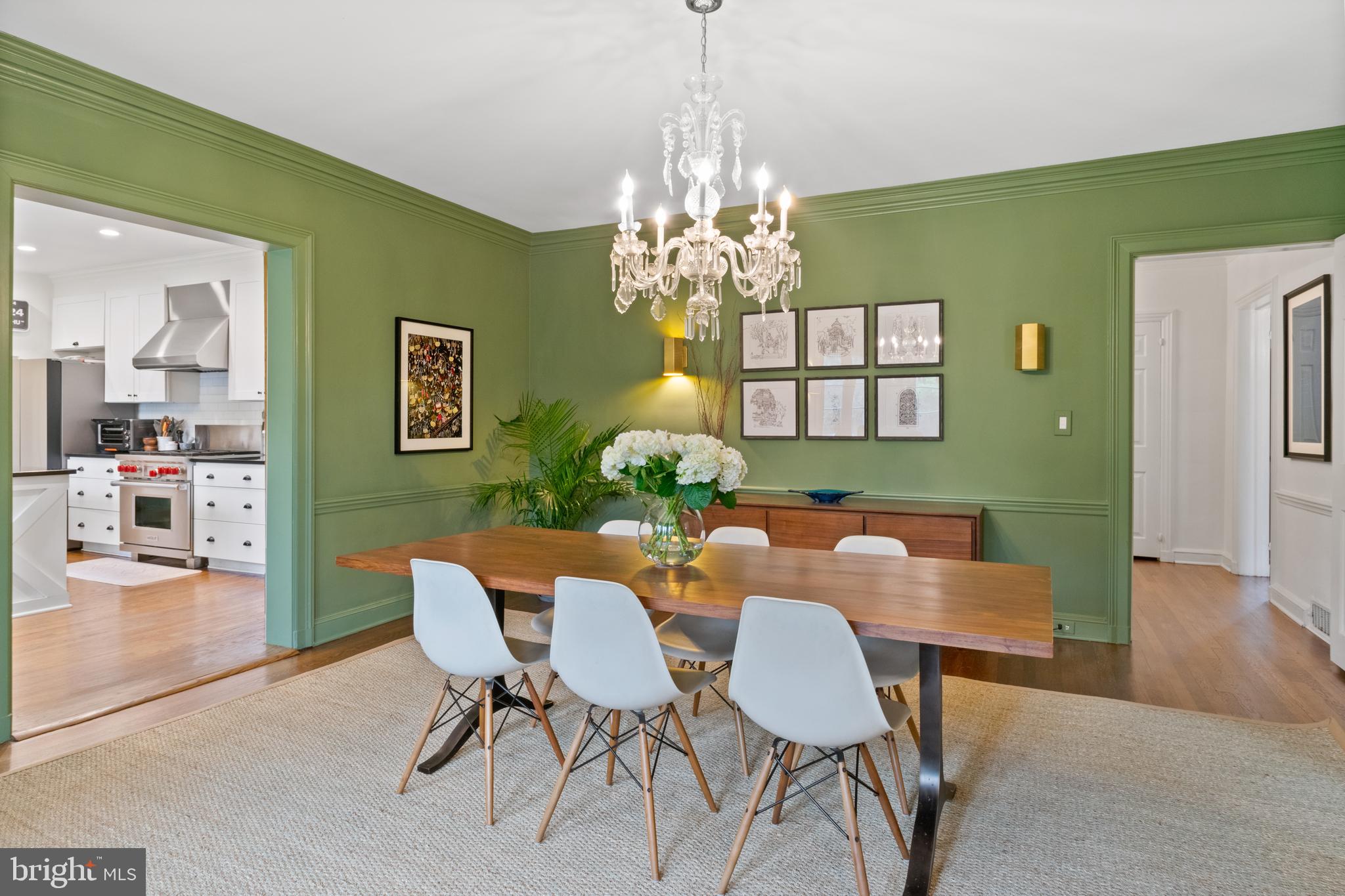 211 Lambeth Road Baltimore, MD 21218 - Photo 23 of 55 a view of a dining room with furniture and a chandelier
