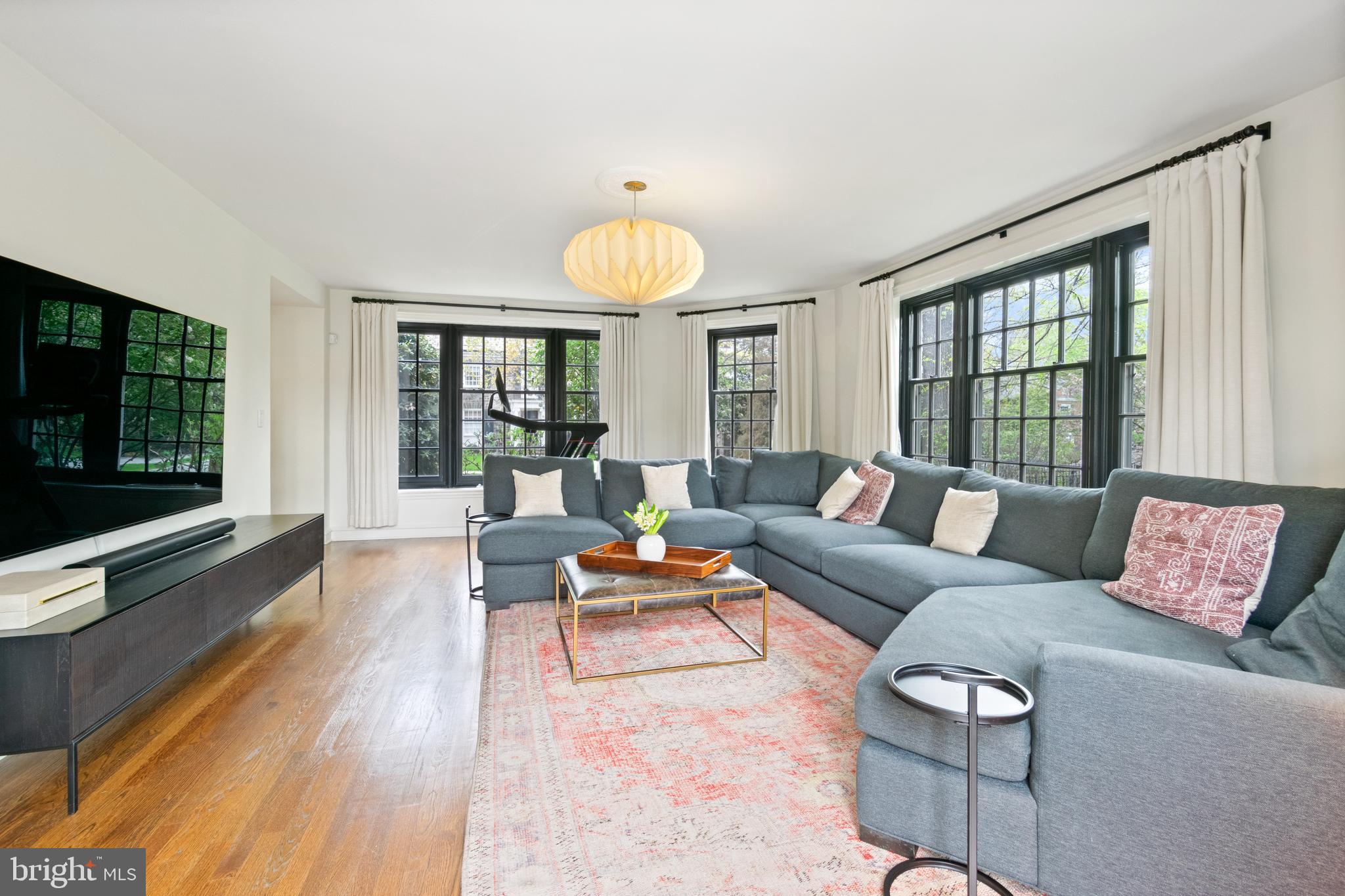 211 Lambeth Road Baltimore, MD 21218 - Photo 30 of 55 a living room with furniture and a flat screen tv