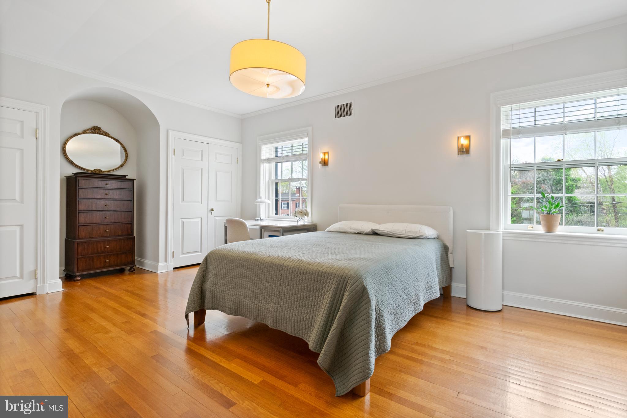 211 Lambeth Road Baltimore, MD 21218 - Photo 39 of 55 a bedroom with a bed dresser and a window