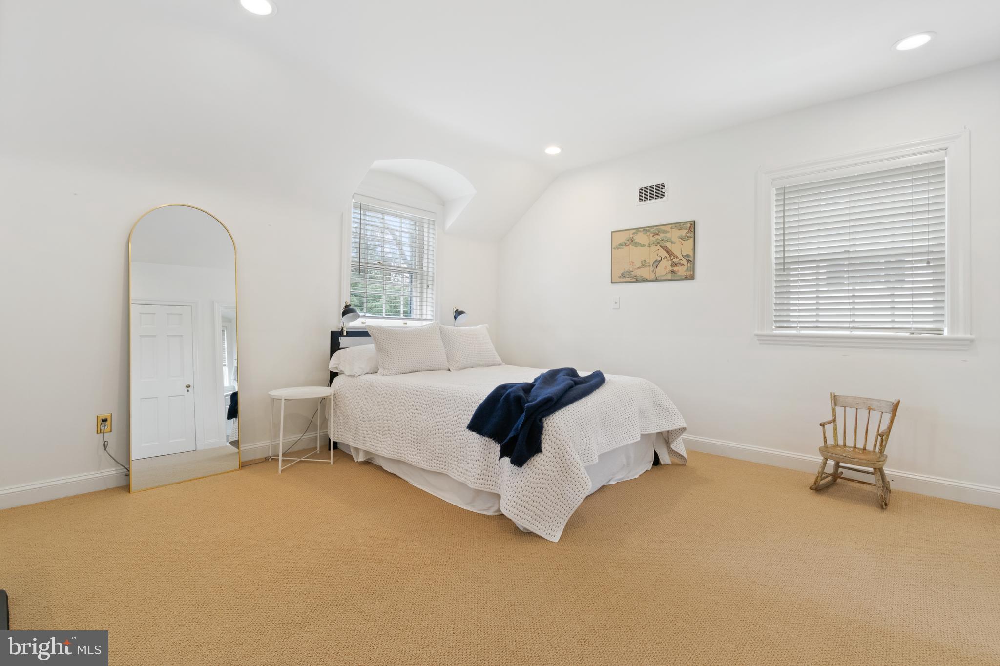 211 Lambeth Road Baltimore, MD 21218 - Photo 40 of 55 a bedroom with a bed and a table