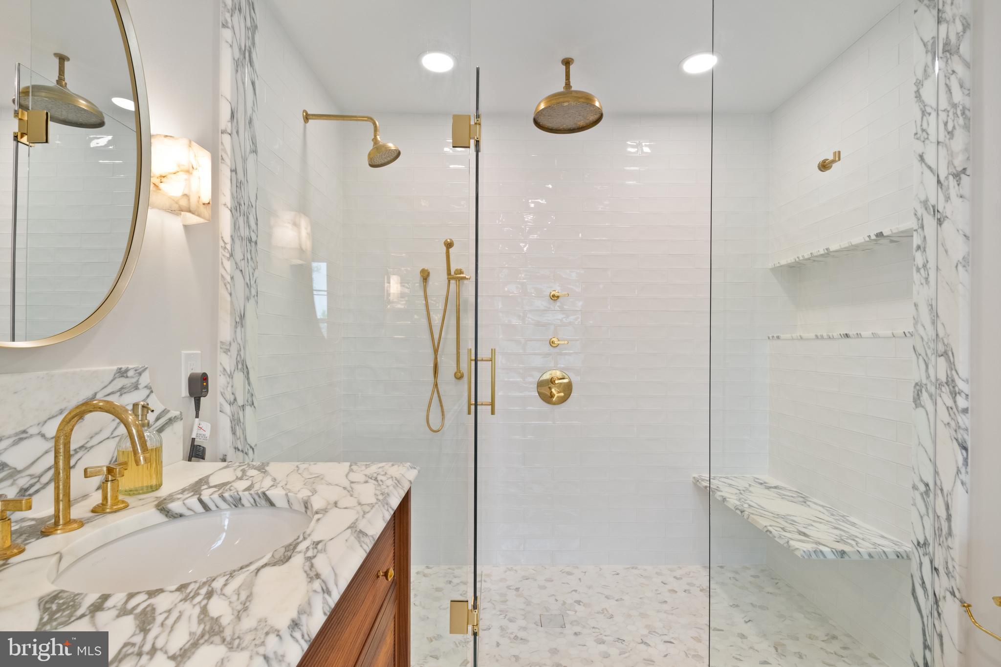 211 Lambeth Road Baltimore, MD 21218 - Photo 49 of 55 a bathroom with a granite countertop sink a mirror and shower