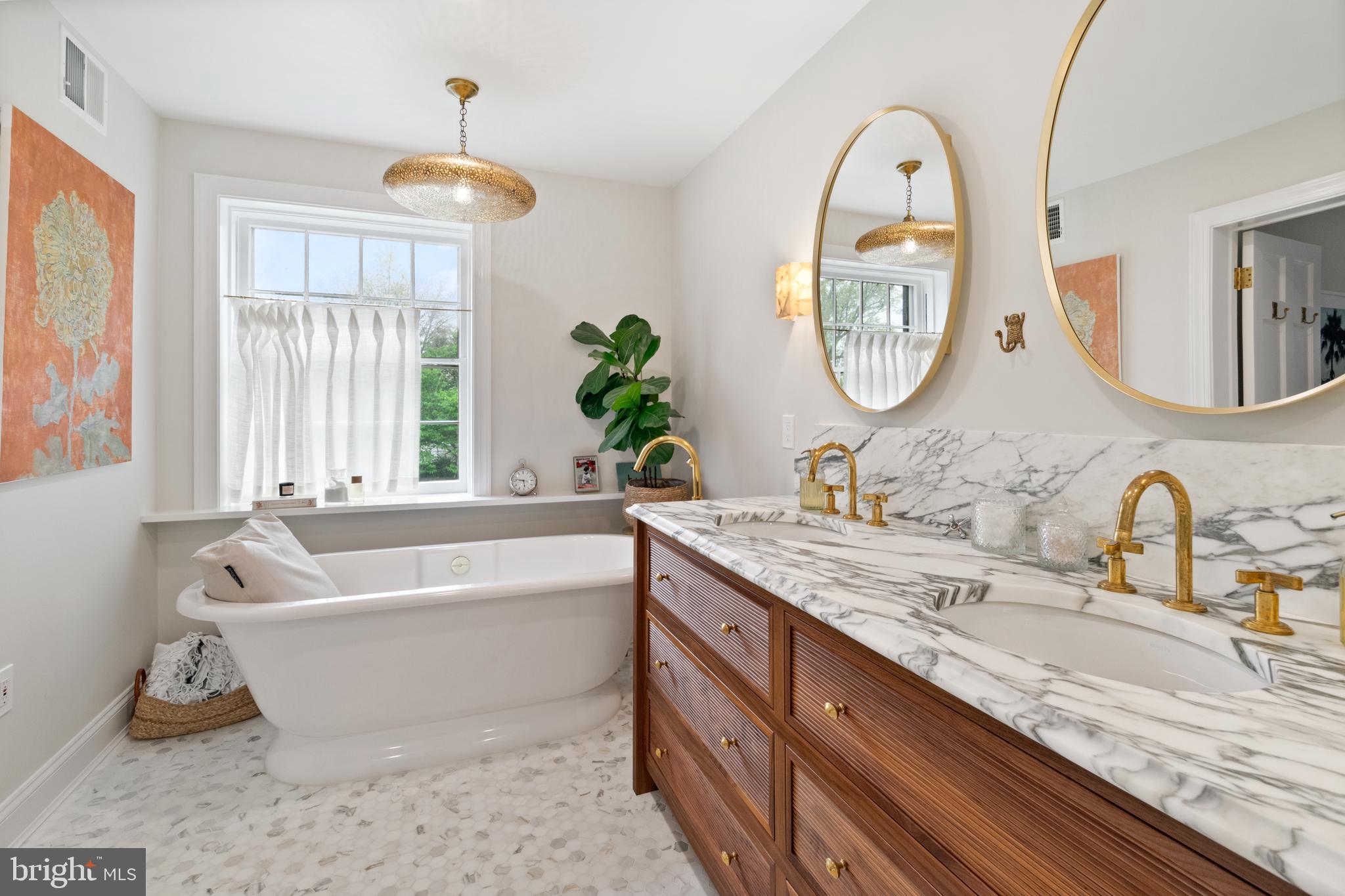211 Lambeth Road Baltimore, MD 21218 - Photo 50 of 55 a bathroom with a granite countertop tub a double vanity sink and a large mirror