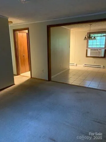 an empty room with windows and entrance