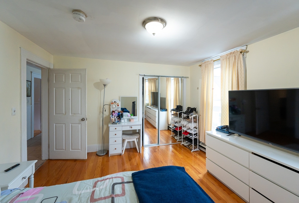 18 Edson Street Lowell, MA 01851 - Photo 16 of 41 a living room with furniture and a flat screen tv